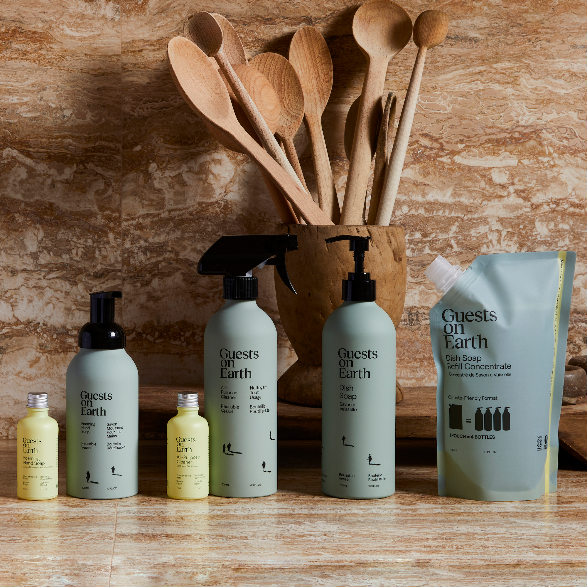 Guests on Earth non-toxic cleaning products lineup with dish soap, all-purpose cleaner, foaming hand soap and refill pouch