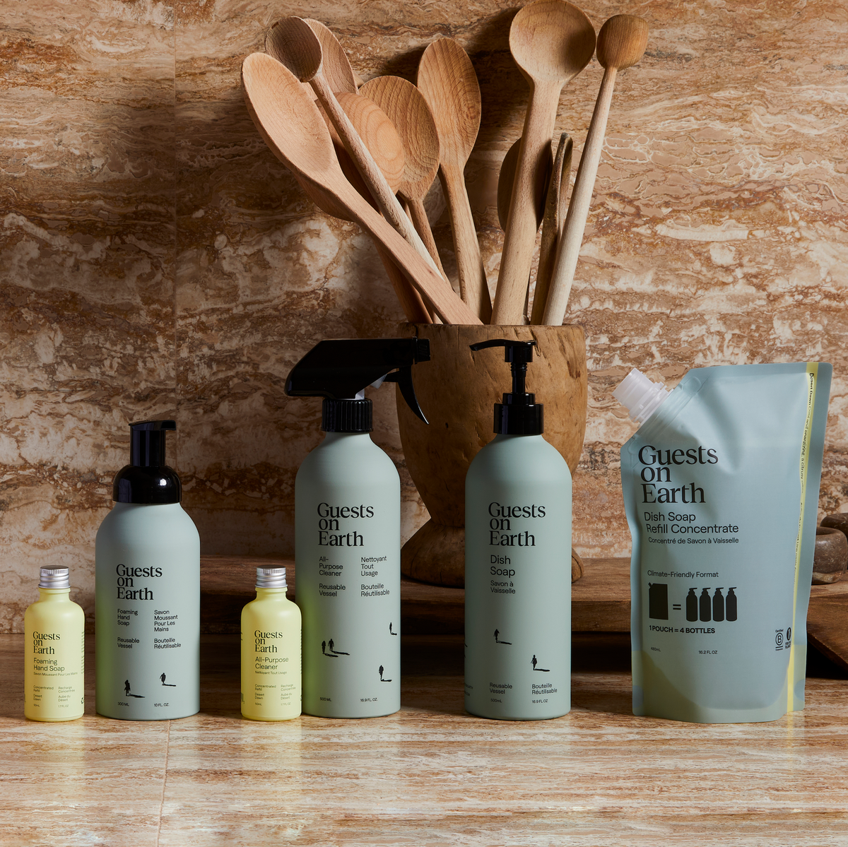 Guests on Earth non-toxic cleaning products lineup with dish soap, all-purpose cleaner, foaming hand soap and refill pouch